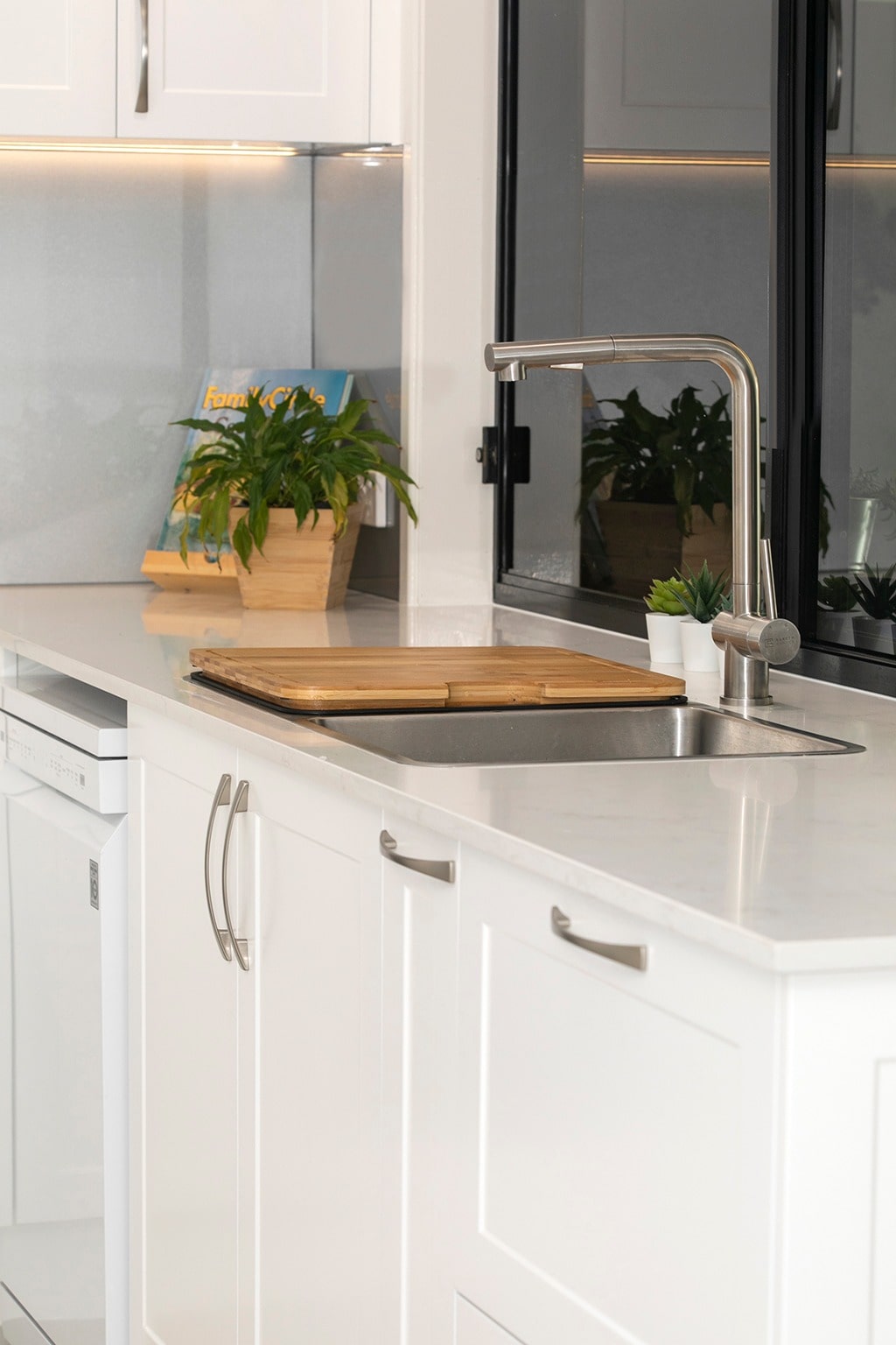 Kitchen renovation with chopping board over sink at Modern Kitchens Northside Brisbane