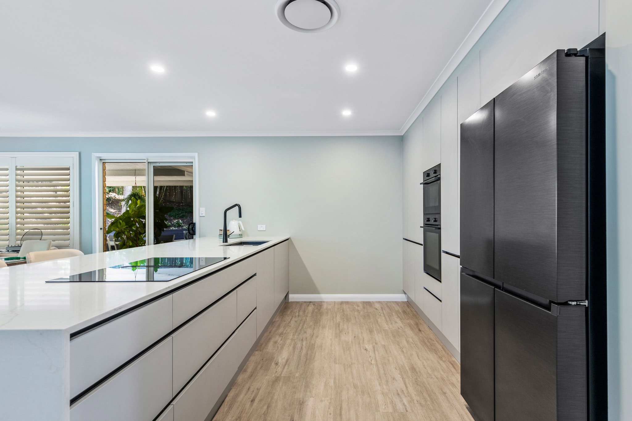 Modern open plan U shape galley kitchen renovation brisbane