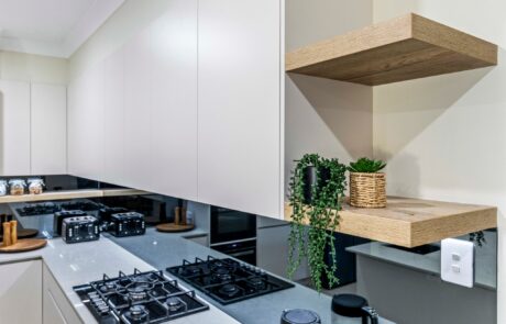 modern style kitchen renovation with glass splashback